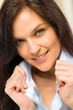 Confident woman holding her shirt's collar