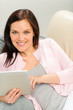 Beautiful joyful woman holding digital tablet