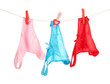Women's panties hanging on rope isolated on white