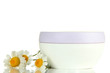 Cosmetic cream with wild camomiles, isolated on white