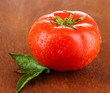 Fresh tomato on wooden background