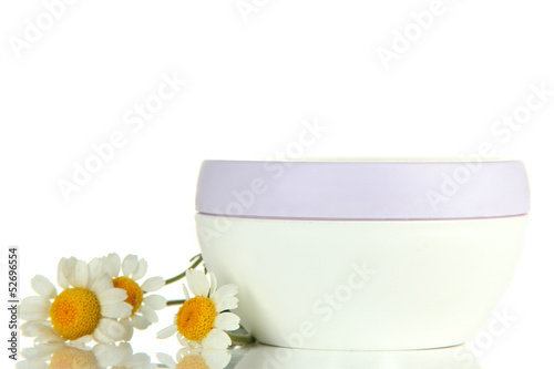 Photo: Cosmetic cream with wild camomiles, isolated on white Cosmetic cream with wild camomiles, isolated on white