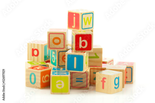 Photo: wooden toy cubes with letters. Wooden alphabet blocks. wooden toy cubes with letters. Wooden alphabet blocks.