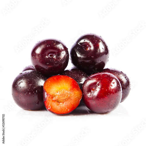 Photo: Red plum fruit isolated on white background. Fresh ripe washed Red plum fruit isolated on white background. Fresh ripe washed