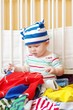 baby chooses clothes for walk