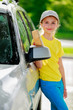 Lovely teenager with sponge over the car for washing