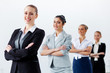 Four businesswomen standing in row