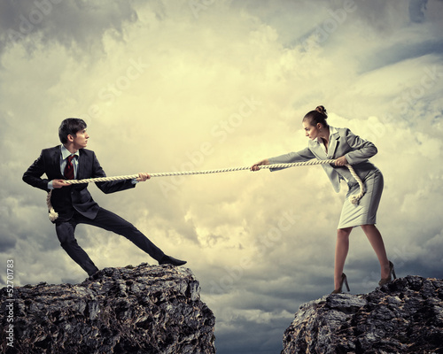 Photo: People pull the rope. People pull the rope.