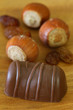 Milk chocolate, hazelnuts and raisins, close up