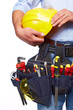 Worker with a tool belt. Construction.