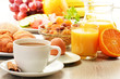 Breakfast with coffee, orange juice, croissant, egg, vegetables