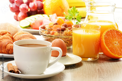 Photo: Breakfast with coffee, orange juice, croissant, egg, vegetables Breakfast with coffee, orange juice, croissant, egg, vegetables