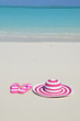 Flip-flops and hat on the beach