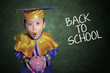 Boy surprise holding piggybank in class