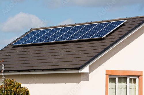 Photo: Photovoltaic Solar Panels on tiled roof Photovoltaic Solar Panels on tiled roof