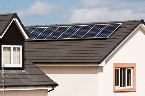 Photo: Photovoltaic Solar Panels on tiled roof Photovoltaic Solar Panels on tiled roof