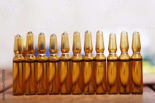 Photo: Row of brown vials filled Row of brown vials filled