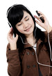 Woman listening to music with the phone and having fun, isolated