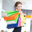 Foto: Shopping woman with color bags Shopping woman with color bags