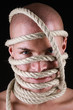 Portrait of a man with rope on his head