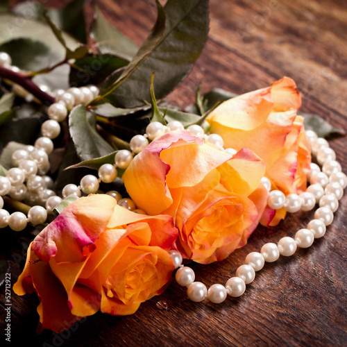 Photo: Orange roses in pearls Orange roses in pearls