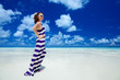 Woman stands at seashore