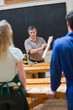 Photo: Explaining teacher and the woodwork class Explaining teacher and the woodwork class