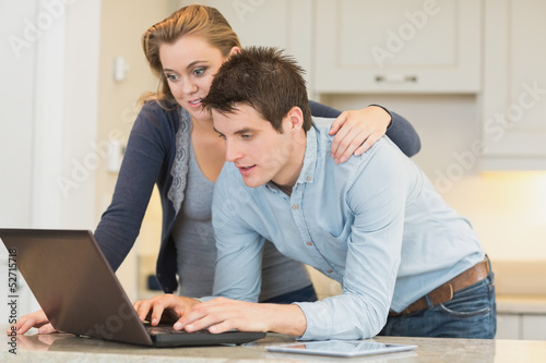 Photo: Couple surfing in the internet Couple surfing in the internet
