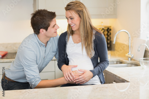 Photo: Young happy pregnant woman with husband Young happy pregnant woman with husband