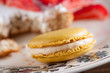 Delicious yellow macaron on a beautiful romantic dish