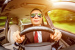 Man driving a car.