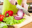 Photo: Woman's hands cutting bulb onion Woman's hands cutting bulb onion