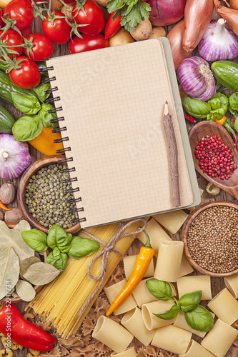 Photo: Assortment of fresh vegetables and recipe book Assortment of fresh vegetables and recipe book