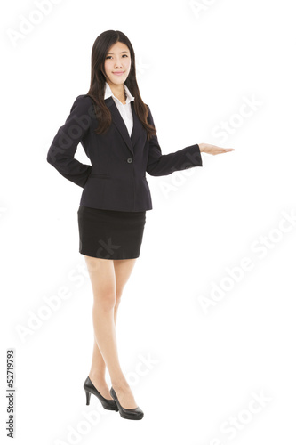 Photo: Smiling asian businesswoman presenting Smiling asian businesswoman presenting