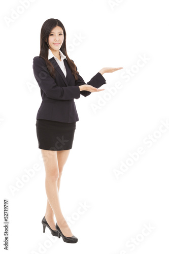Photo: Smiling business woman presenting Smiling business woman presenting