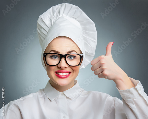 Photo: Smile woman cook chef showing thumbs up Smile woman cook chef showing thumbs up