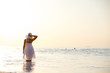 Caucasian woman rests at beautiful seashore