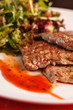 steak with salad