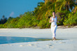 Caucasian woman jogging at seashore
