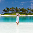Caucasian woman rests at beautiful seashore