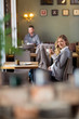 Pregnant Woman Drinking Coffee At Cafe