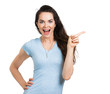 Happy woman pointing at copy-space.