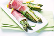 Green and white asparagus wrapped in prosciutto ham