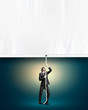 Businessman pulling blank banner