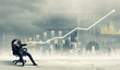 Businessman pulling graph