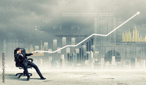 Photo: Businessman pulling graph Businessman pulling graph