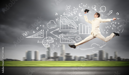 Photo: Jumping young businessman Jumping young businessman