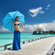 Woman on a beach jetty at Maldives
