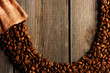 Photo: Coffee beans and bag background Coffee beans and bag background