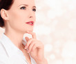 Photo: Pretty businesswoman against the abstract background Pretty businesswoman against the abstract background